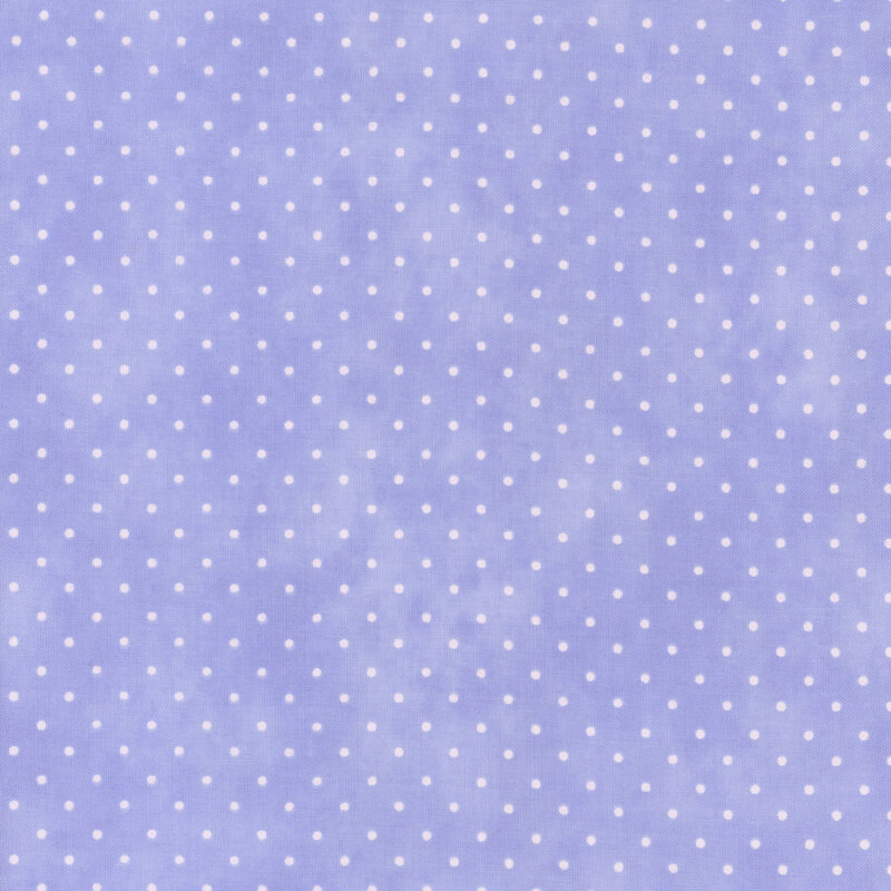 Mottled pastel lilac fabric with an even pattern of polka dots.