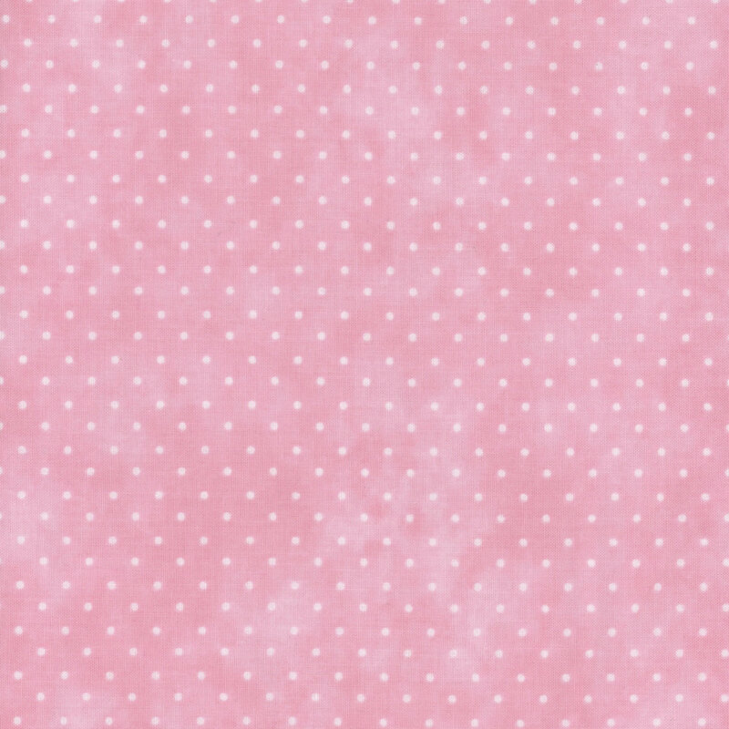 Mottled pink fabric with an even pattern of polka dots.