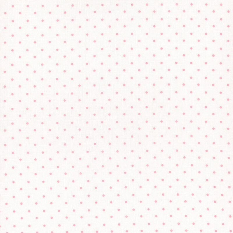 A white fabric with a repeating pattern of small pink dots.