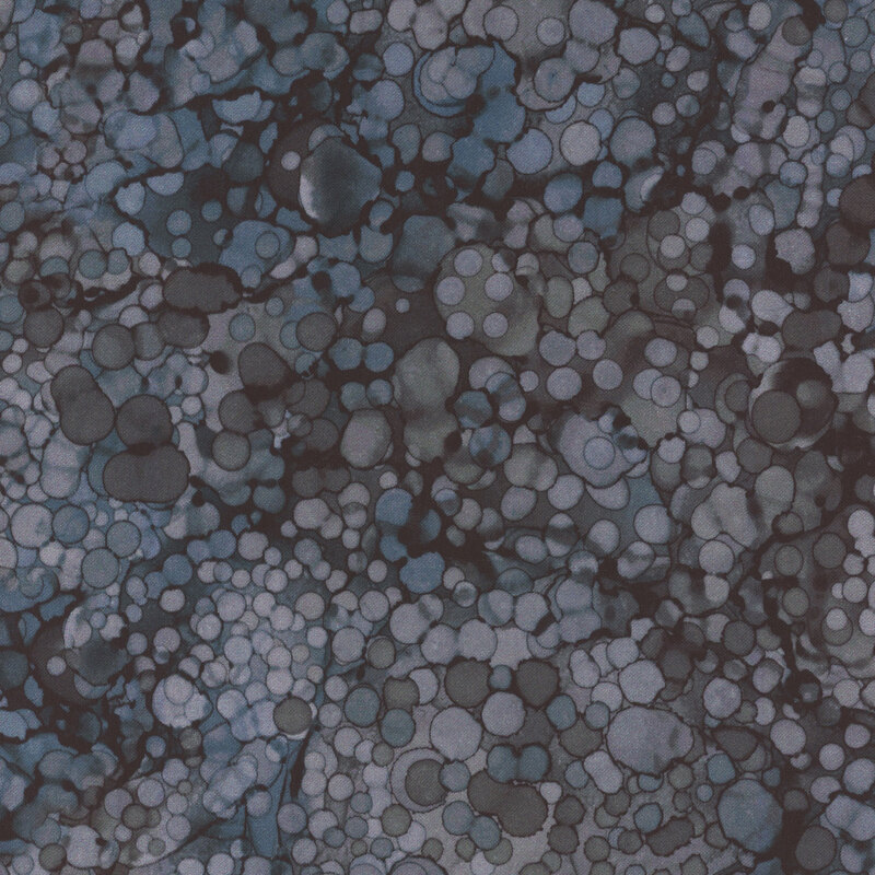 Abstract pattern featuring varying shades of blue and gray circles against a dark background.