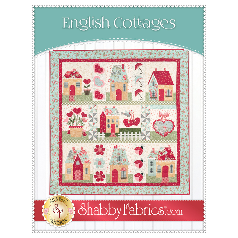 Front cover of the English Cottages pattern showing a completed version of the quilt, hung on a white paneled wall.