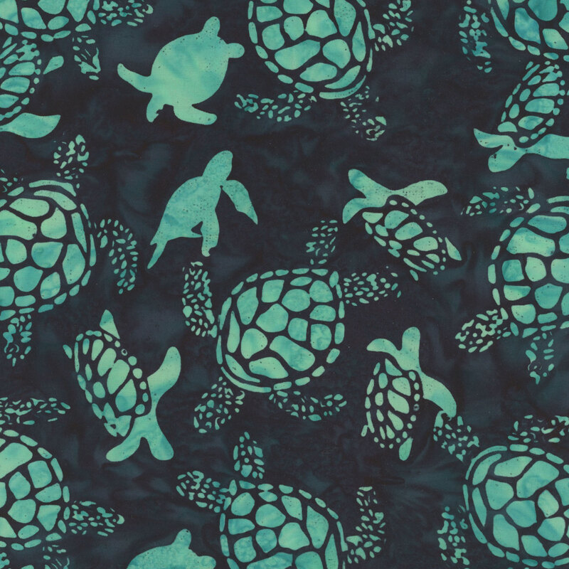 Dark teal batik fabric with mottled turquoise turtles. 