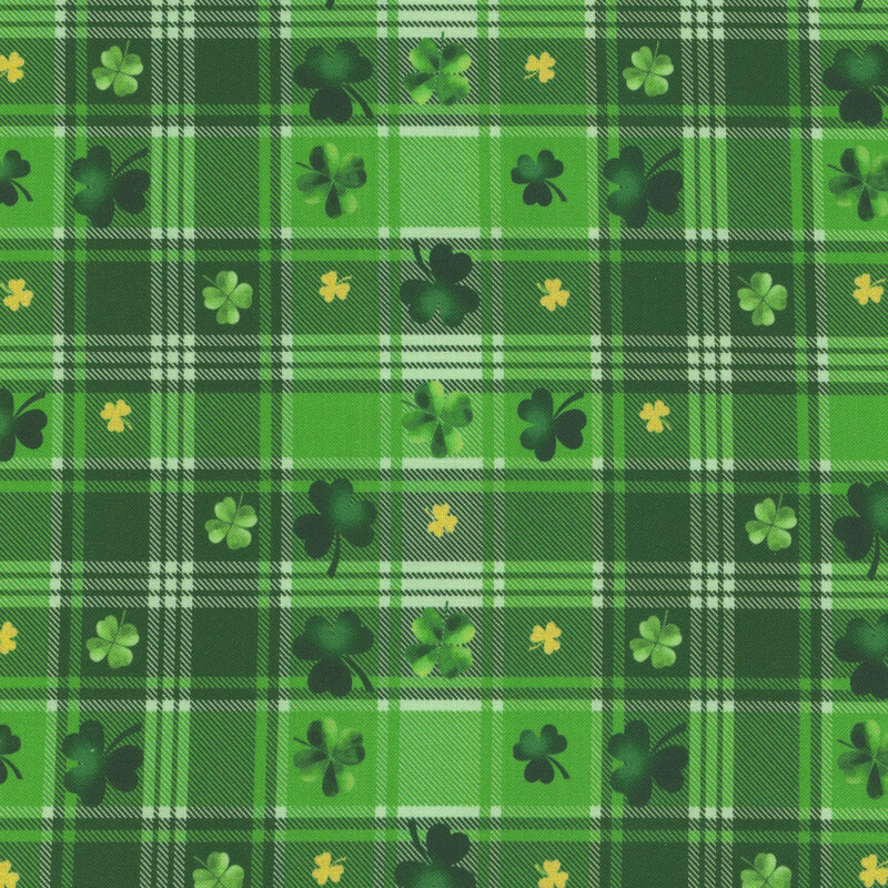 Green and white plaid fabric with tossed green and gold shamrocks.