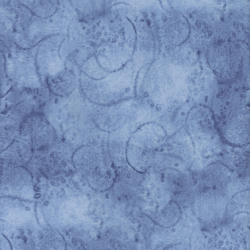 Blue fabric with abstract circular patterns and a mottled appearance.