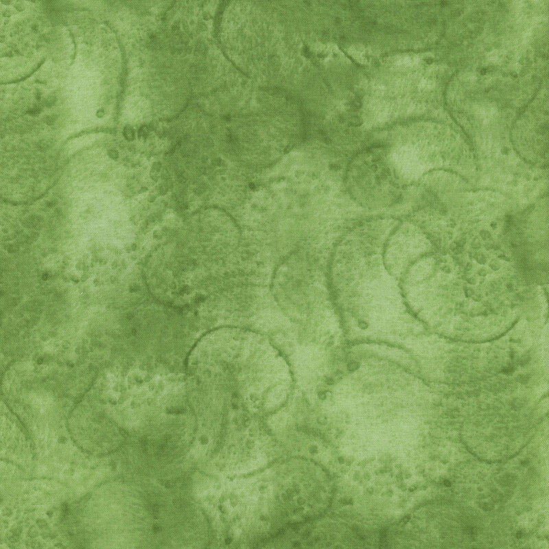 Abstract green fabric with swirling patterns and varying shades of green throughout.