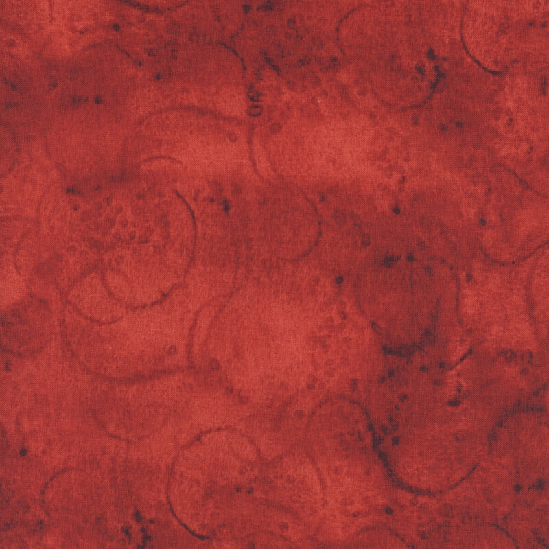 Fabric in rich red hues with subtle patterns and variations.