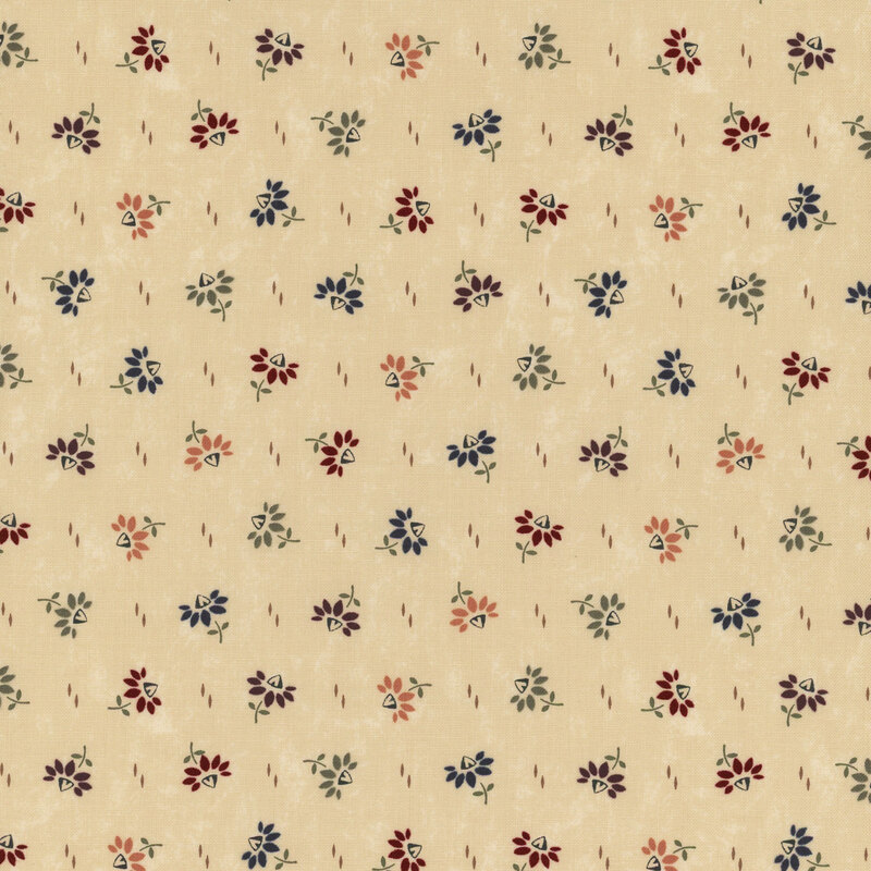 A beige fabric background featuring small, colorful floral patterns in red, blue, green, and orange.