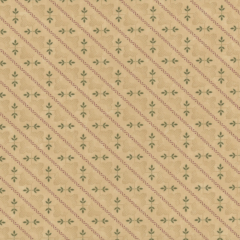 Tan fabric with diagonal stripes featuring green leaves and red swirls, with a ruler along the bottom.