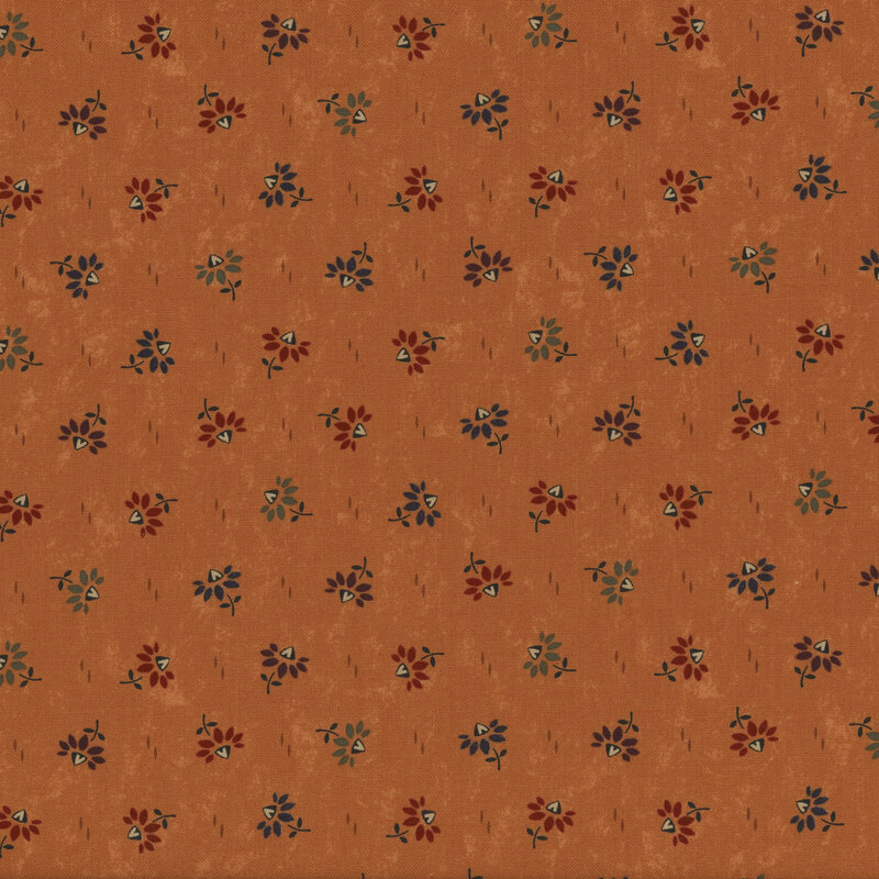 Tan fabric featuring a scattered floral pattern in red, blue, and yellow with a textured background.