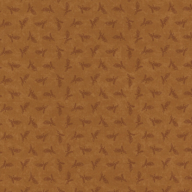 Brown fabric featuring a subtle floral print with small leaves, bordered by a ruler at the bottom.