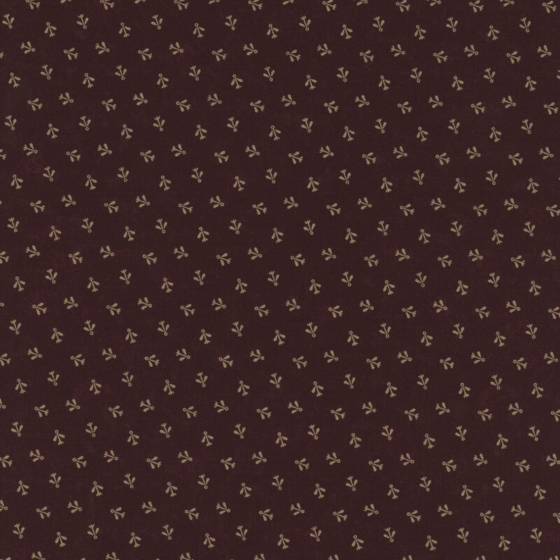 Brown fabric with a repeating pattern of small, light-colored floral motifs.