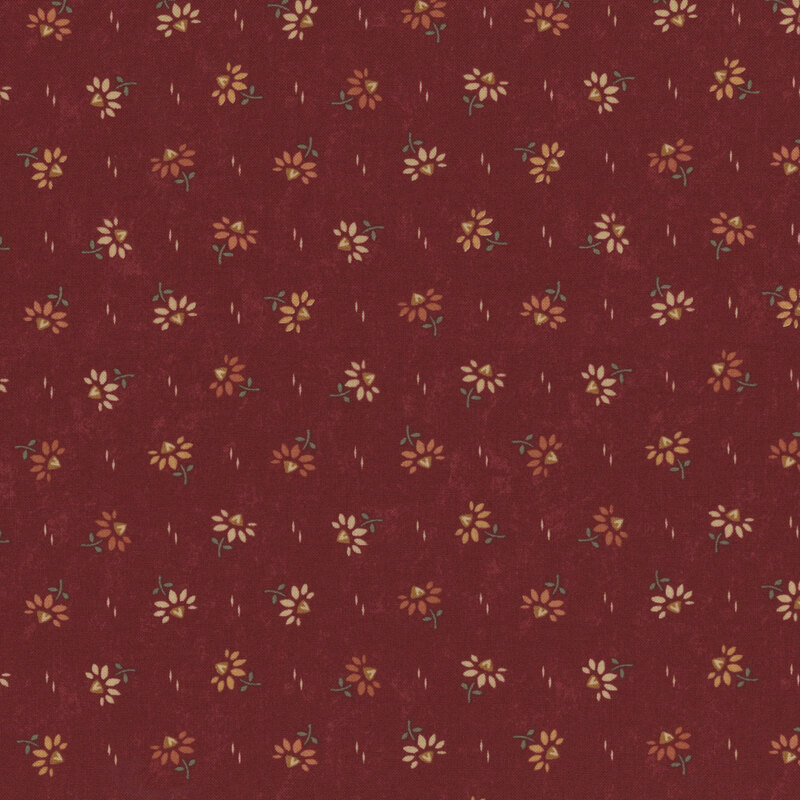 A textured maroon fabric with small yellow flowers scattered uniformly across the surface.