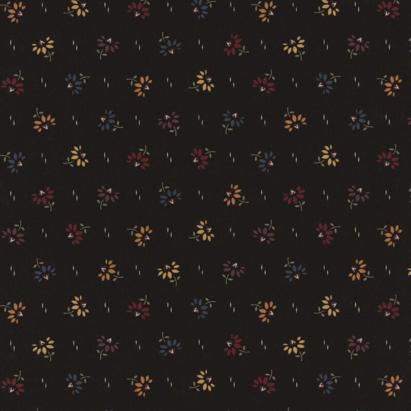 Black fabric with a scattered floral pattern in yellow, red, and blue shades.