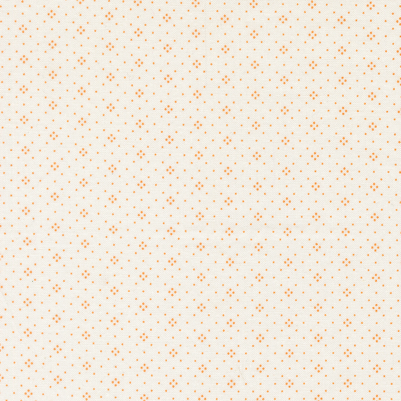 Light cream fabric with a dense pattern of small orange dots evenly distributed throughout.