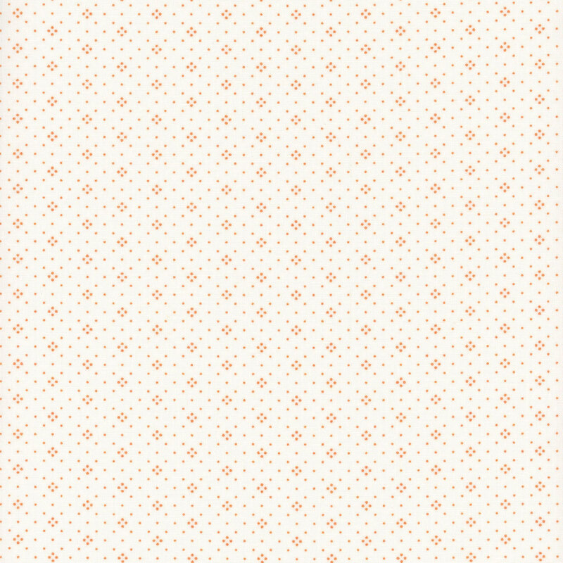 Light cream fabric with a dense pattern of small orange dots evenly distributed throughout.