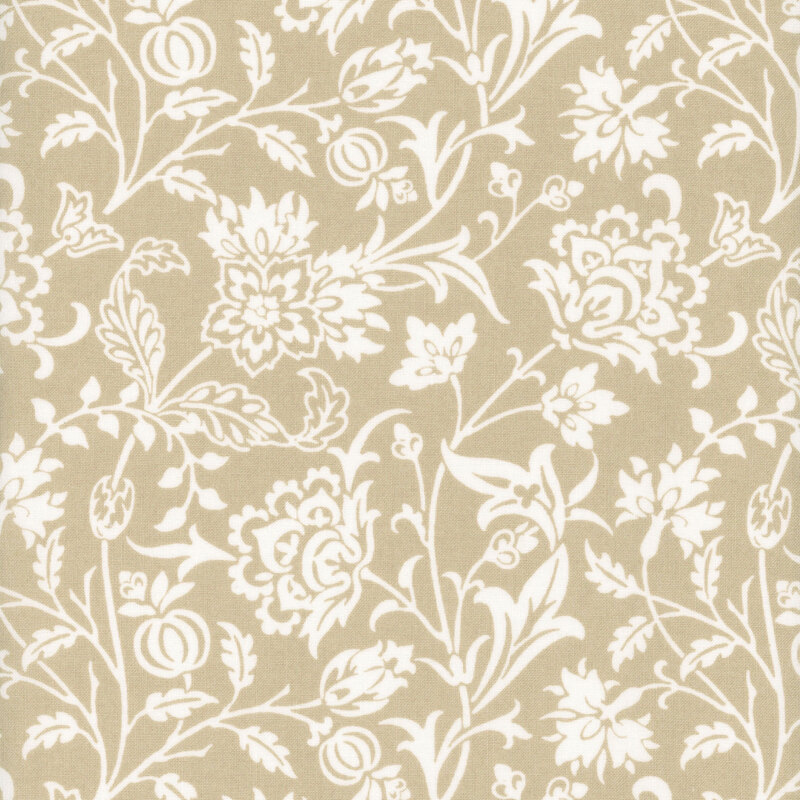 A tan fabric featuring white floral and vine patterns in an intricate design.