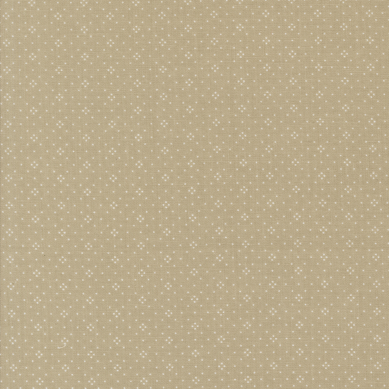 Beige fabric with a subtle pattern of small white stars evenly spaced across the surface.