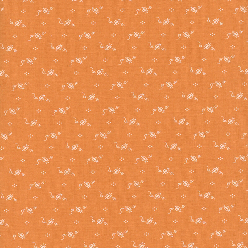 Orange fabric with a repeated white pattern of whimsical designs, including swirls and flowers.