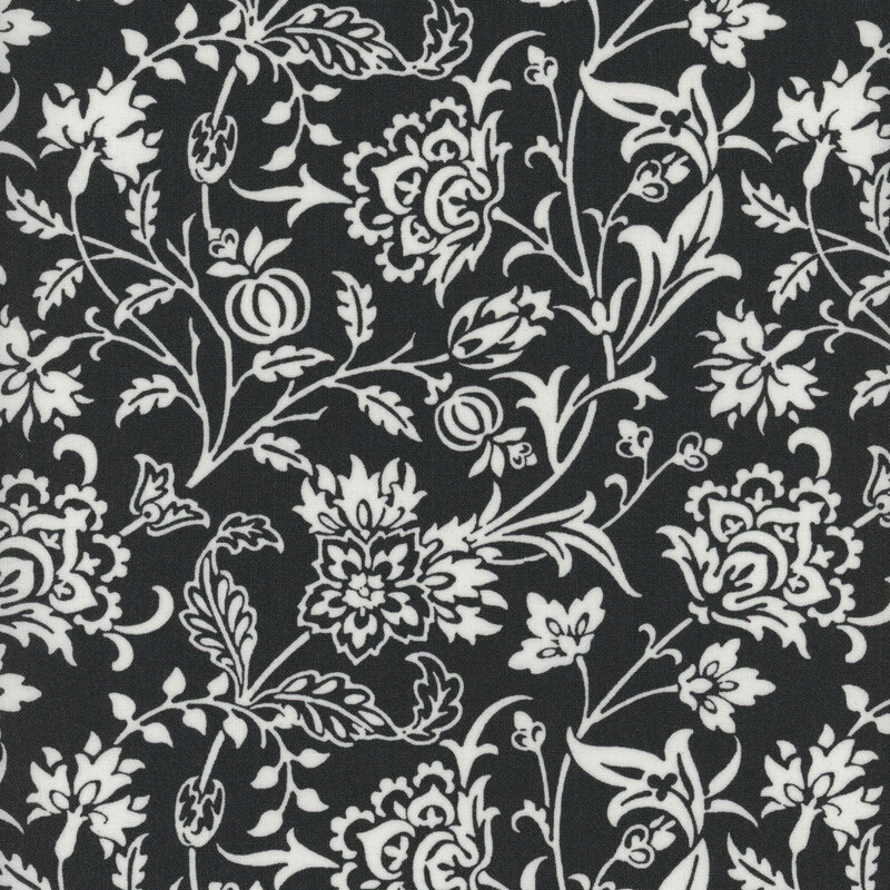 Black fabric with a white floral pattern featuring various flowers and leaves throughout.