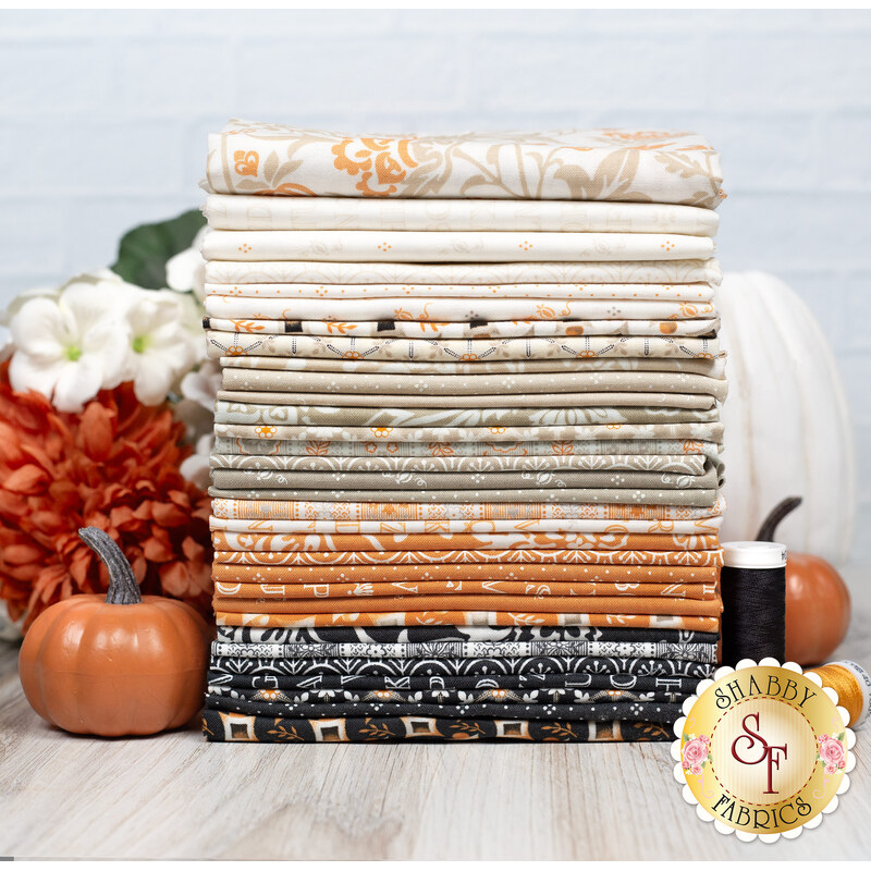 A stack of the 32 fabric swatches from the Agatha Road collection, in various patterns and shades of cream, orange, and gray, with pumpkins, flowers, and thread.