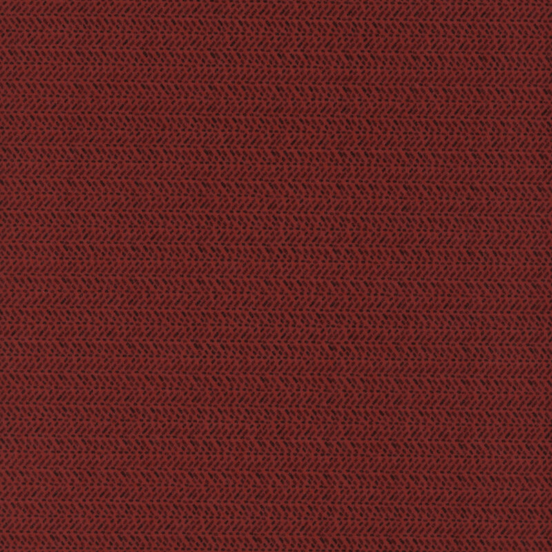 Fabric in a deep red color with a subtle herringbone pattern.