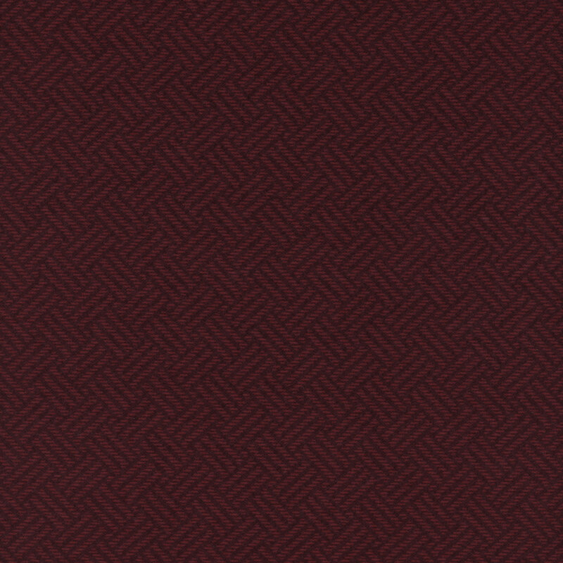 Dark burgundy fabric featuring a woven textured design