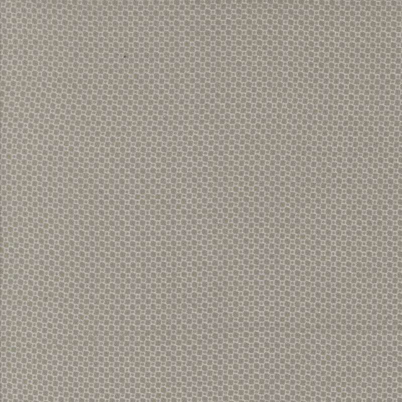 Light gray fabric with a subtle, textured pattern of tiny squares.