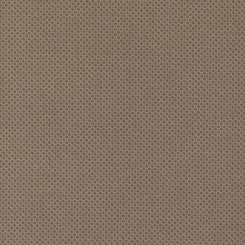 Light brown fabric with a subtle, textured pattern of tiny squares.