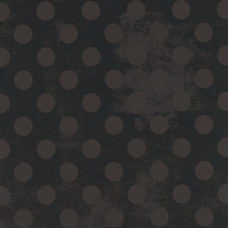 Black fabric featuring large, textured gray polka dots arranged in a repeating pattern.