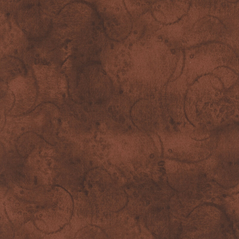 Brown mottled fabric with swirls and partial tonal circles all over for a textured effect