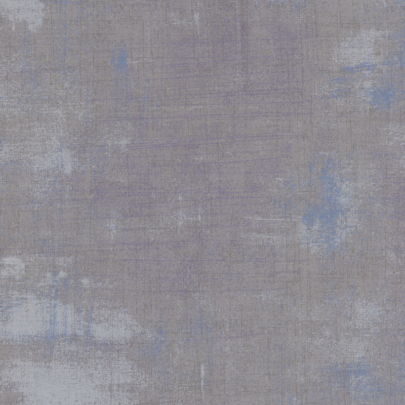 Light gray fabric with bits of blue grunge texturing