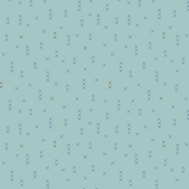 Light blue fabric with scattered, geometric X shapes in varying shades of blue and brown.