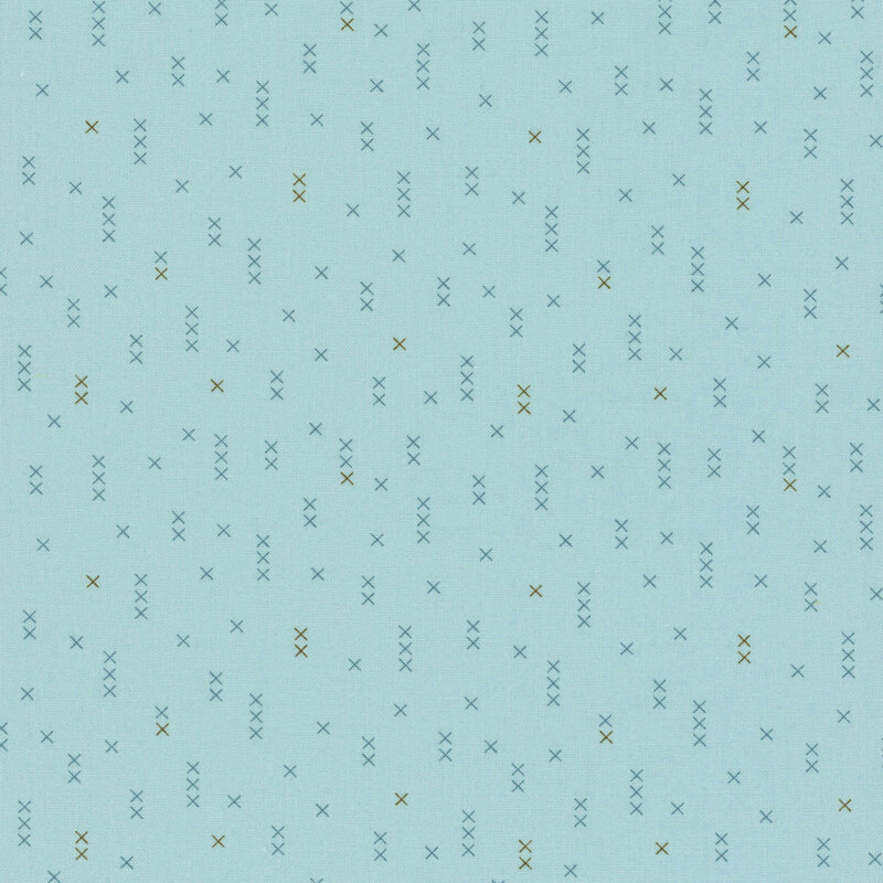 Light blue fabric with scattered, geometric X shapes in varying shades of blue and brown.