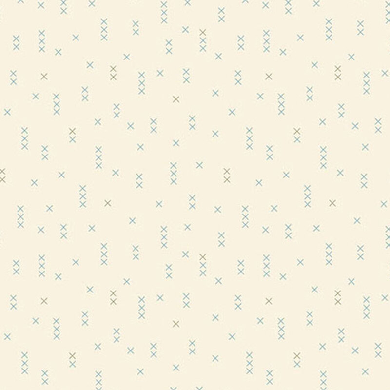 A fabric pattern featuring scattered light blue and green X shapes on a cream background.