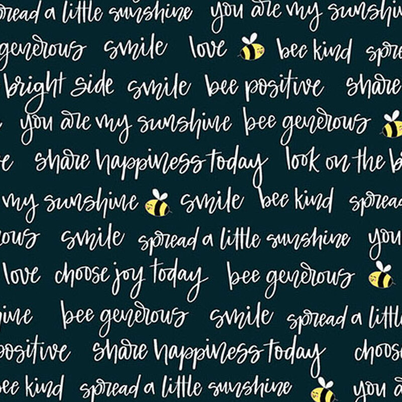 A dark fabric featuring handwritten phrases about positivity, kindness, and bees.