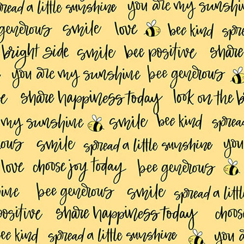 fabric with motivational phrases like spread a little sunshine and bees on a yellow surface.