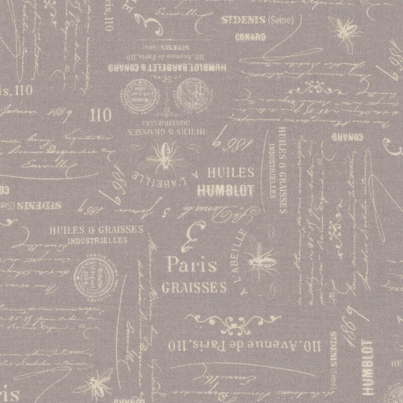 Stone gray fabric with bees and coins laid out amongst French cursive script.