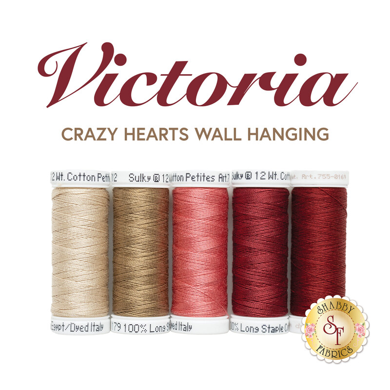 Spools of thread in beige, pink, and red arranged under Victoria Crazy Hearts Wall Hanging title.