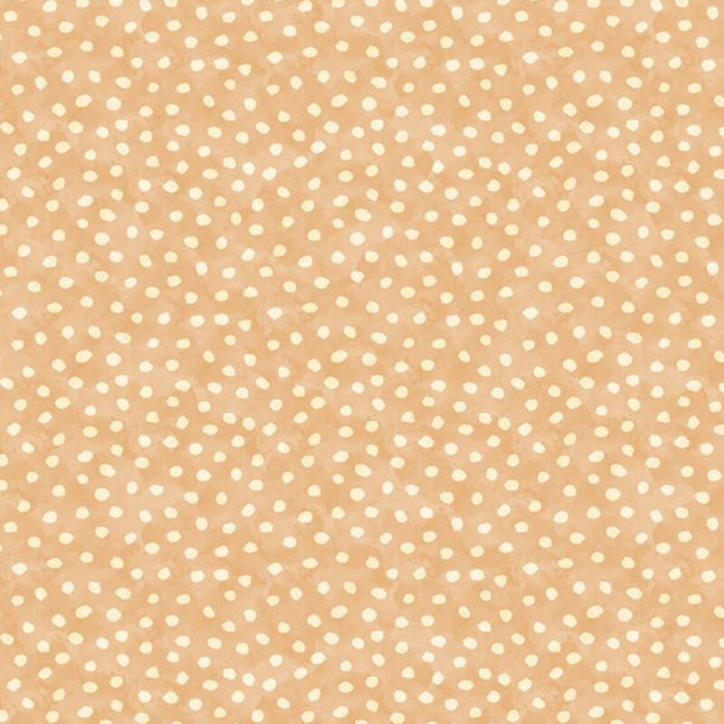 A fabric with a warm beige color and scattered white polka dots.