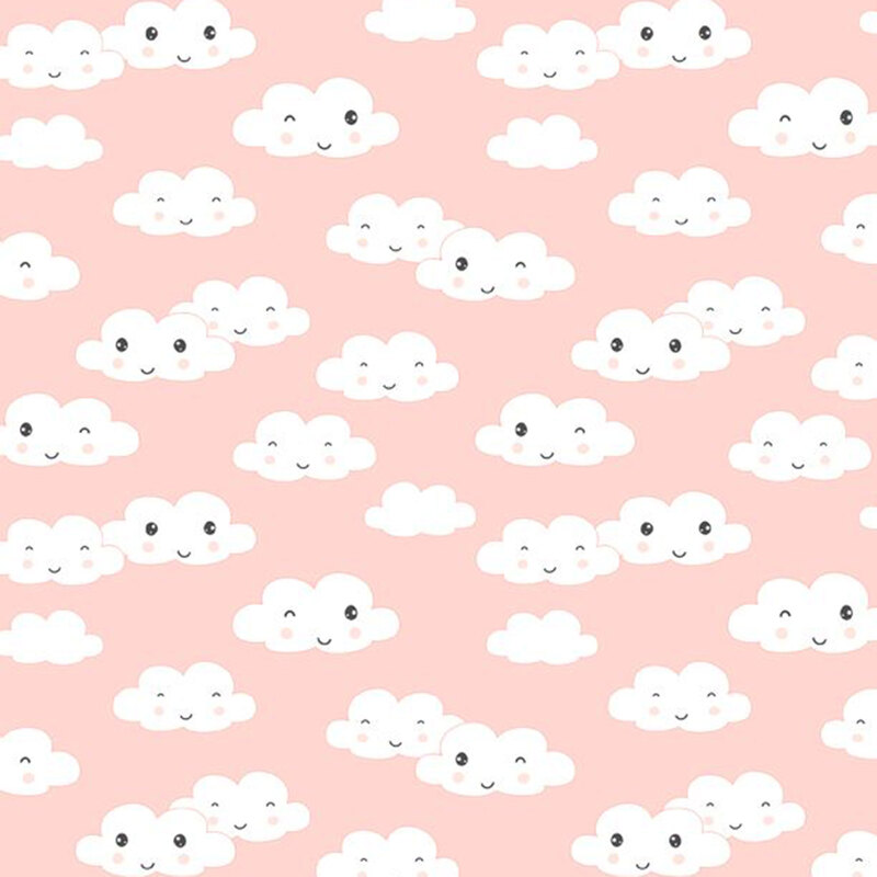 A pastel peach pink fabric with tossed white clouds with cute smiling and winking faces.