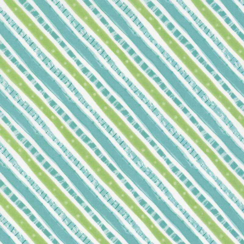 A white fabric with squiggly diagonal stripes in blue and green.