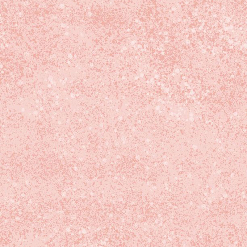 A pastel peach pink fabric with subtle mottling and a tonal spray effect.