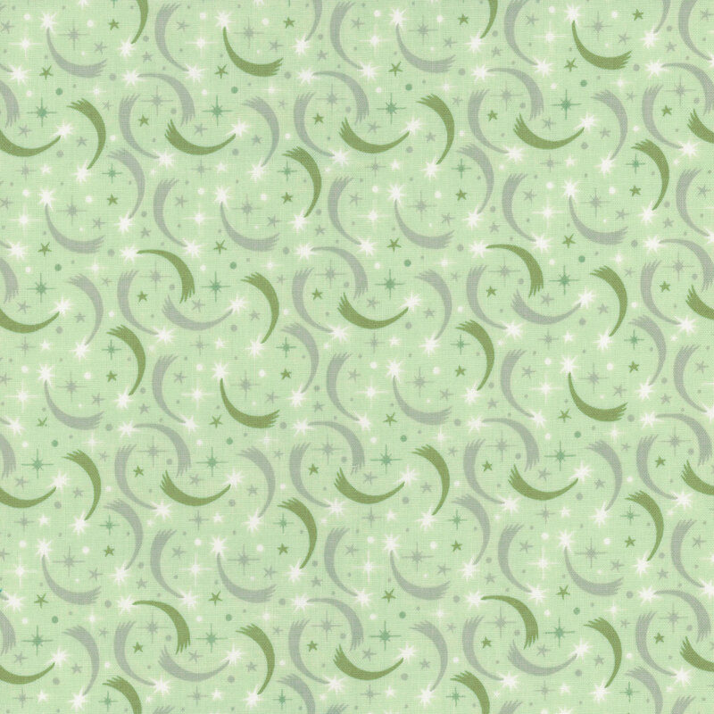 fabric pattern of curled motifs with colors of dark and sage green with white stars scattered on a light green background
