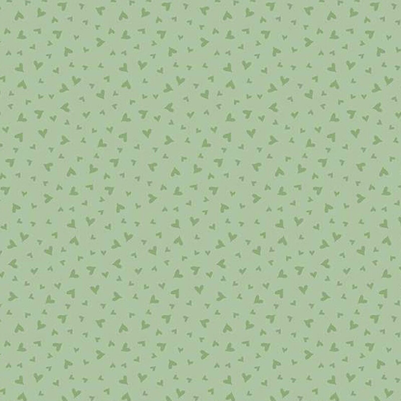 fabric pattern of dark green hearts on a green background