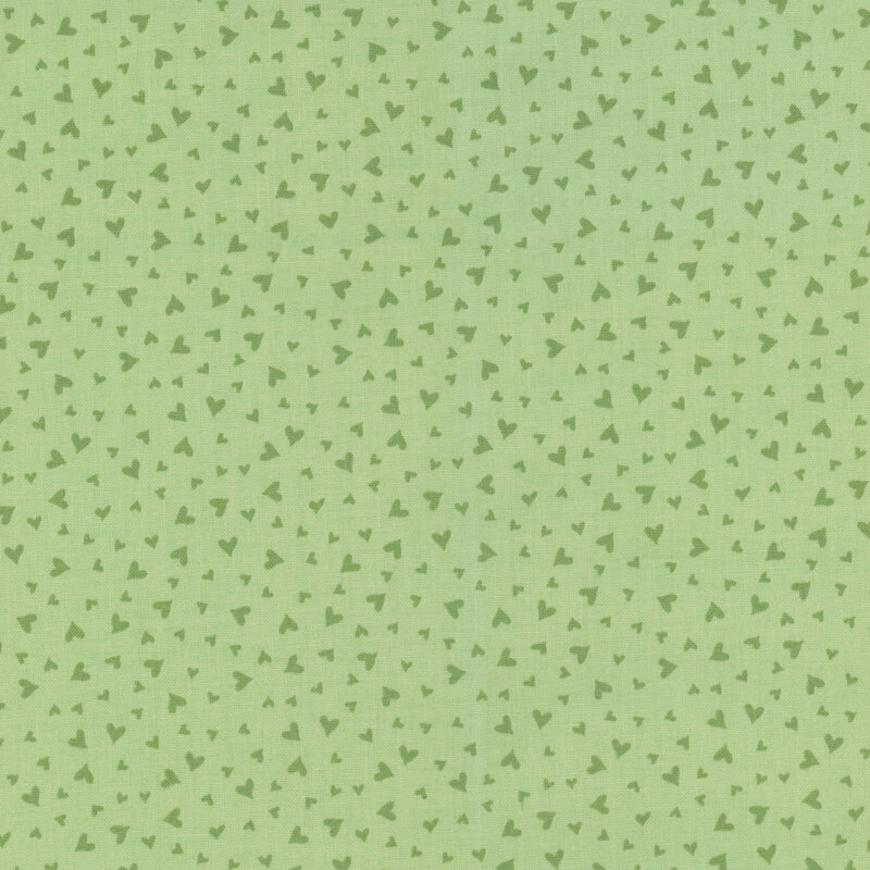fabric pattern of dark green hearts on a green background
