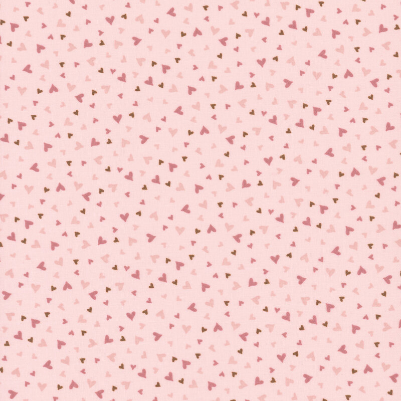 fabric pattern of dark pink hearts on a light pink background