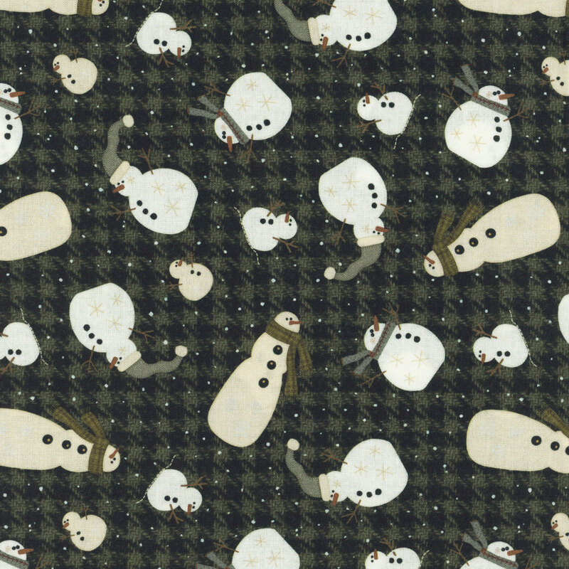 A dark patterned fabric featuring various snowmen in different sizes and styles.