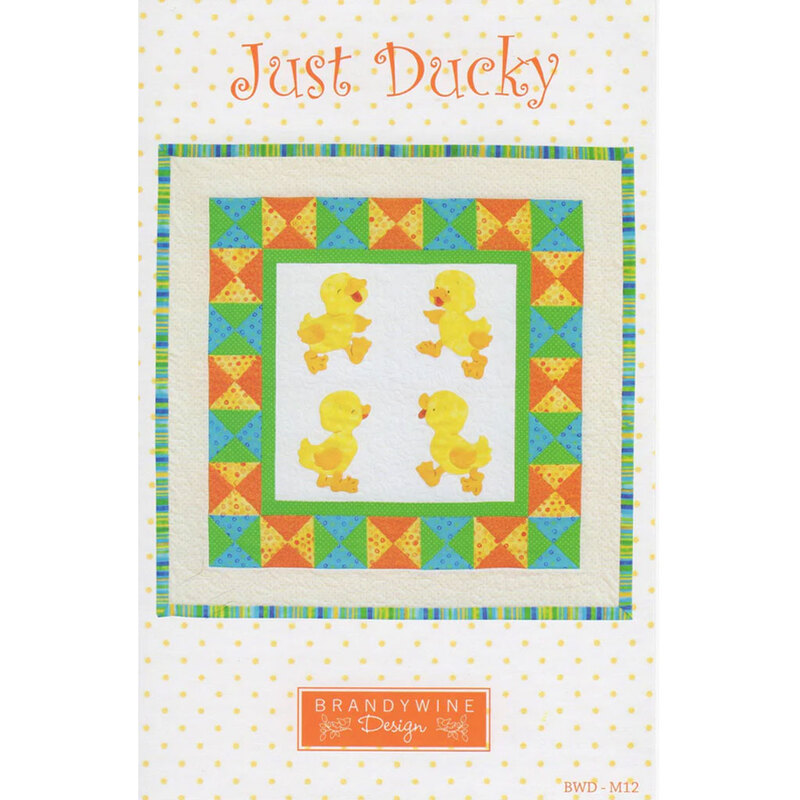 A quilt pattern titled Just Ducky featuring yellow ducklings in a colorful patterned border.