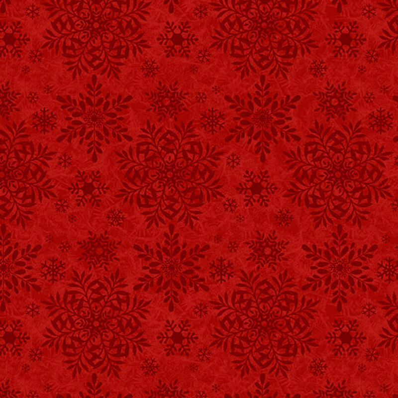 Red fabric with a tonal snowflake pattern in varying sizes.