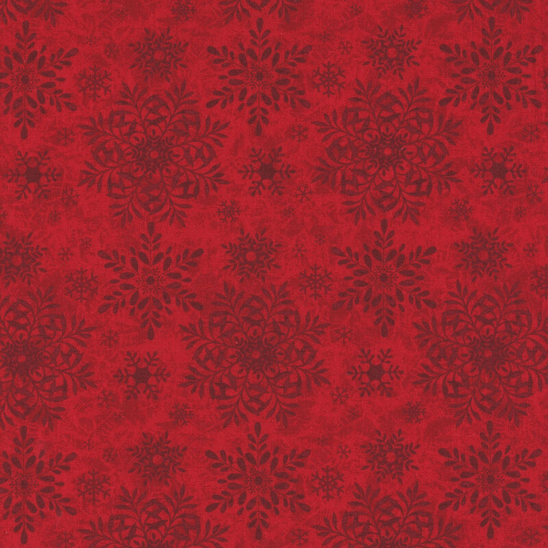 Red fabric with a tonal snowflake pattern in varying sizes.